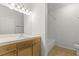 Bright bathroom with a single sink vanity, tile floors, and a shower over tub at 5250 S Rainbow Blvd # 2106, Las Vegas, NV 89118