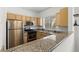 Well-equipped kitchen featuring modern appliances, granite counters, and plenty of storage at 5250 S Rainbow Blvd # 2106, Las Vegas, NV 89118
