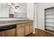 Modern kitchen with stainless steel dishwasher and ample countertop space overlooking living area at 5250 S Rainbow Blvd # 2106, Las Vegas, NV 89118