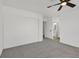 Cozy bedroom featuring gray carpet, a closet, and an open doorway to a bathroom at 540 Kelsford Dr, Las Vegas, NV 89123
