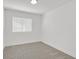 Bright bedroom featuring neutral carpet, white walls, and a window with blinds at 540 Kelsford Dr, Las Vegas, NV 89123