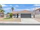 Charming single-story home featuring a two-car garage, landscaped front yard, and a classic tile roof at 540 Kelsford Dr, Las Vegas, NV 89123
