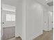 Hallway leading to bedroom featuring fresh paint, new floors and neutral tones at 540 Kelsford Dr, Las Vegas, NV 89123