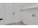 Laundry room featuring tile floors, white walls, utility sink, and white door at 540 Kelsford Dr, Las Vegas, NV 89123