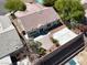 Aerial view showcasing a backyard with a patio, desert landscaping, and privacy fencing for outdoor relaxation at 6032 Red Glitter St, North Las Vegas, NV 89031