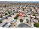 Overhead shot of a home with pool, indicated by a location pin in a neighborhood filled with desert landscaping at 6032 Red Glitter St, North Las Vegas, NV 89031