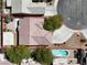 Aerial view of a home, highlighted by a red outline, featuring a private pool and well-manicured landscaping at 6032 Red Glitter St, North Las Vegas, NV 89031