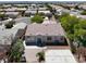 Back aerial view of a single-story home featuring a block fence, patio, small yard and an AC unit at 6032 Red Glitter St, North Las Vegas, NV 89031
