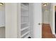 Hallway featuring an open shelved pantry, with access to other rooms at 6032 Red Glitter St, North Las Vegas, NV 89031