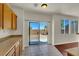 Well-lit eat-in kitchen with hardwood cabinets and a view of the backyard at 6032 Red Glitter St, North Las Vegas, NV 89031