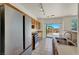 Eat-in kitchen features stainless steel appliances and hardwood cabinets overlooking the backyard at 6032 Red Glitter St, North Las Vegas, NV 89031