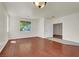 Inviting living room featuring hardwood flooring, neutral paint, a large sunny window, and recessed lighting at 6032 Red Glitter St, North Las Vegas, NV 89031