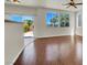 Bright living room features hardwood floors, large windows and sliding door access to backyard at 6032 Red Glitter St, North Las Vegas, NV 89031