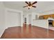 Open-concept living room with hardwood floors leading into the adjacent kitchen area at 6032 Red Glitter St, North Las Vegas, NV 89031
