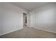 Bedroom with neutral walls, carpeted floors, and an open doorway at 6056 Atlantis Dream Ave, Las Vegas, NV 89139