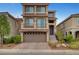 Charming three-story home with a two-car garage and well-manicured landscaping at 6056 Atlantis Dream Ave, Las Vegas, NV 89139