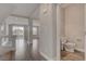 Hallway view leads to half bathroom; lots of natural light at 6056 Atlantis Dream Ave, Las Vegas, NV 89139