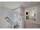 Bright hallway featuring a window and an open doorway to a bedroom with stylish decor at 6056 Atlantis Dream Ave, Las Vegas, NV 89139