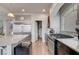 Well-lit kitchen with granite countertops, modern appliances, and walk-in pantry at 6056 Atlantis Dream Ave, Las Vegas, NV 89139