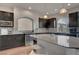 Well-equipped kitchen with stainless steel appliances, ample counter space, and dark wood cabinets at 6056 Atlantis Dream Ave, Las Vegas, NV 89139