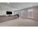 Bright living room with recessed lighting, multiple windows, and access to the backyard at 6056 Atlantis Dream Ave, Las Vegas, NV 89139