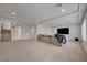 Large living room featuring neutral decor, recessed lighting, plush carpet, and access to the stairs at 6056 Atlantis Dream Ave, Las Vegas, NV 89139