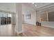 Bright, open living room featuring hardwood floors and access to outdoor balcony at 6056 Atlantis Dream Ave, Las Vegas, NV 89139