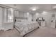 Luxurious main bedroom featuring a tufted headboard, modern lighting, and neutral decor at 6056 Atlantis Dream Ave, Las Vegas, NV 89139