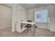 Home office with natural light, neutral color palette, carpet flooring, and simple desk setup at 6056 Atlantis Dream Ave, Las Vegas, NV 89139