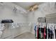 Organized walk-in closet with ample storage space and clothing racks at 6056 Atlantis Dream Ave, Las Vegas, NV 89139