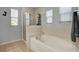 Bright bathroom featuring a glass shower enclosure and separate soaking tub at 6271 Sunset Spring Ave, Las Vegas, NV 89122