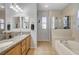 Bright bathroom boasting double sinks, a tub, and a separate glass shower at 6271 Sunset Spring Ave, Las Vegas, NV 89122
