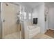 Bright bathroom featuring a glass shower enclosure and separate soaking tub at 6271 Sunset Spring Ave, Las Vegas, NV 89122