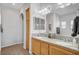 Spacious bathroom featuring a double vanity, large mirror, and neutral color scheme at 6271 Sunset Spring Ave, Las Vegas, NV 89122