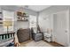 Well-lit Bedroom with a rocking chair, changing table, and tasteful decor at 6271 Sunset Spring Ave, Las Vegas, NV 89122