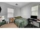 Cozy bedroom featuring a comfortable bed and a functional workspace at 6271 Sunset Spring Ave, Las Vegas, NV 89122
