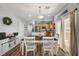 Bright dining area featuring a table with white chairs, and sliding doors to outdoor space at 6271 Sunset Spring Ave, Las Vegas, NV 89122