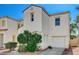 Inviting home with manicured front yard, tiled roof, and attached garage at 6271 Sunset Spring Ave, Las Vegas, NV 89122