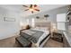 Bright main bedroom highlighting large bed, bench, and matching nightstands at 6271 Sunset Spring Ave, Las Vegas, NV 89122