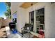 Enclosed patio area with BBQ, chairs, and sliding glass door for indoor/outdoor living at 6271 Sunset Spring Ave, Las Vegas, NV 89122