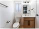 Modern bathroom with wood cabinet vanity, and chic gold fixtures at 6324 Eugene Ave, Las Vegas, NV 89108