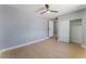 Bedroom with modern fan, wood-look floors, and closet at 6324 Eugene Ave, Las Vegas, NV 89108