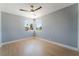 Bedroom with wood-look floors, modern fan, and lots of light at 6324 Eugene Ave, Las Vegas, NV 89108