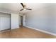 Bedroom with modern fan, wood-look floors, closet, and ensuite bathroom at 6324 Eugene Ave, Las Vegas, NV 89108