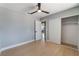 Bedroom with modern fan, wood-look floors, closet, and ensuite bathroom at 6324 Eugene Ave, Las Vegas, NV 89108