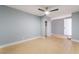 Bedroom with modern fan, wood-look floors, closet, and ensuite bathroom at 6324 Eugene Ave, Las Vegas, NV 89108