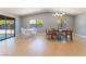 Bright dining area with sliding glass doors and two dining tables at 6324 Eugene Ave, Las Vegas, NV 89108