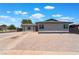 Charming single-story home featuring a well-kept desert landscape, red door, and multiple windows at 6324 Eugene Ave, Las Vegas, NV 89108