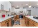 Modern kitchen with white cabinets, stainless steel appliances, and stylish backsplash at 6324 Eugene Ave, Las Vegas, NV 89108