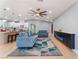 Inviting living room open to the kitchen featuring modern furnishings, lighting, and wood flooring at 6324 Eugene Ave, Las Vegas, NV 89108